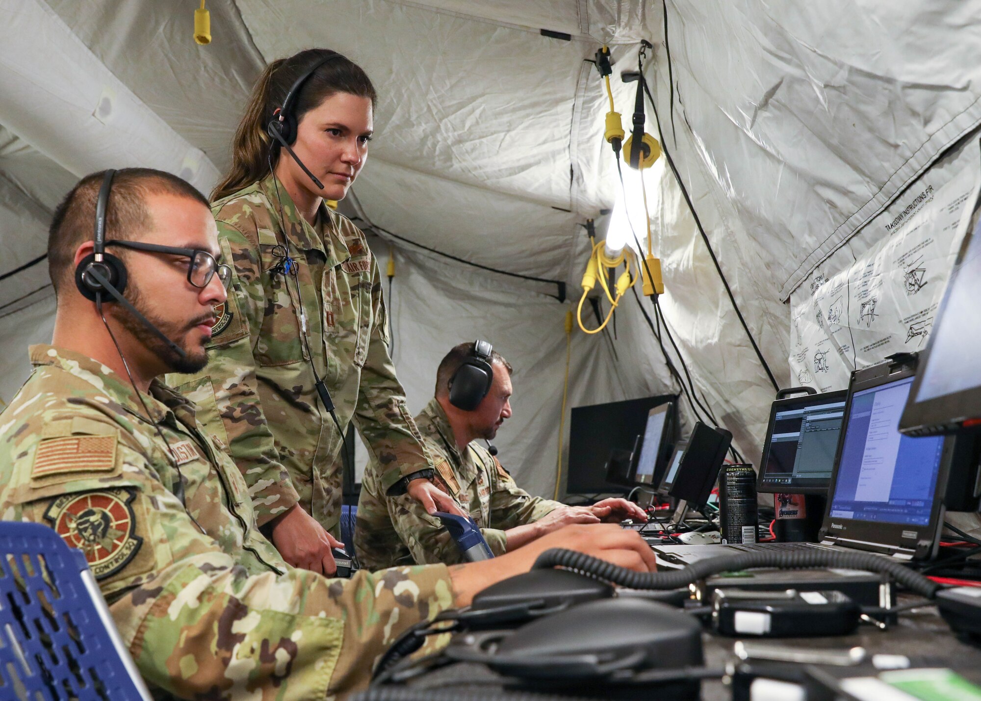 photo of military members working on computers