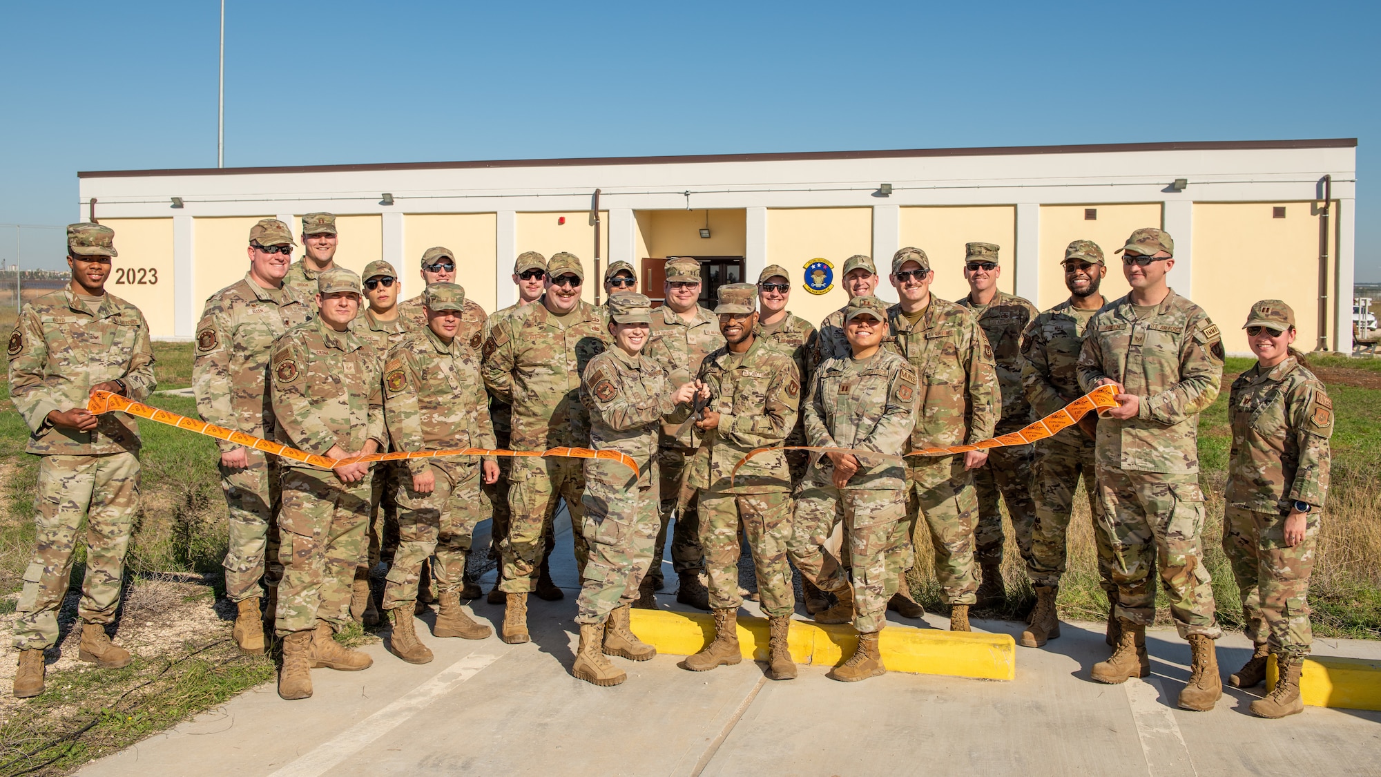 Airmen assigned to the 39th Maintenance Squadron participate in the 39th MXS munitions flight building dedication ceremony at Incirlik Air Base, Türkiye, Dec. 19, 2022. The 39th MXS munitions flight building was designed to provide a streamlined means of communication within the ammunitions flight and assist Airmen in building camaraderie and teamwork. The building also provides better protection for munitions assets controlled by the flight and consolidates six sections into a single building, increasing productivity for current and future Airmen. (U.S. Air Force photo by Senior Airman David D. McLoney)