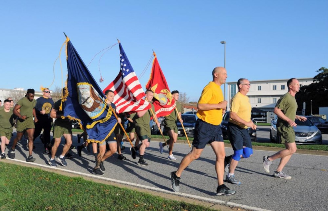 Colonel Christopher A. Browning, Commanding Officer, Expeditionary Warfare Training Group, Atlantic, Captain Darren W. Nelson, Executive Officer, Master Gunnery Sergeant David Menusa, Senior Enlisted Leader, and Aviation Electronics Technician Senior Chief William R. Liddle, Senior Enlisted Advisor, lead the command in a Marine Corps birthday formation run. In celebration of the United States Marine Corps' 247th birthday, Marines, Sailors, and Civilians of Expeditionary Warfare Training Group, Atlantic (EWTGLANT) participate in a 247 mile run. This USMC birthday celebration run began the afternoon of Monday, November 7th with individual runners running in 10 minute continuous increments, over two nights, for the initial 246 miles and finished the 247th mile with a formation run on Wednesday, November 9th. (U.S. Marine Corps photo by Brandon E. Holmes)