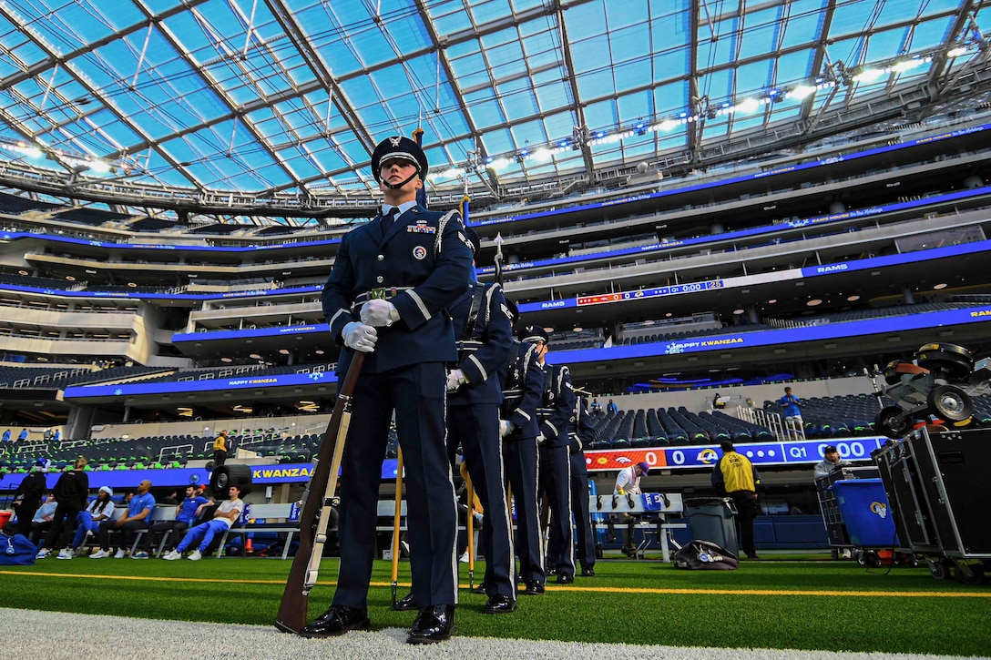 Guardians stand in a line on a football field.