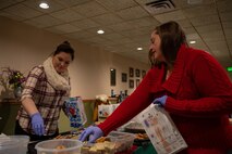 Key Spouses, Volunteers and the local Minot community came together to donate cookies for the Annual Cookie Drive this year, delivering over 9,000 cookies to Airmen on Minot Air Force Base, North Dakota, Dec. 21, 2022. These Airmen sacrifice time away from loved ones to ensure the strategic deterrence mission is carried out. (U.S. Air Force photo by Airman 1st class Alexander Nottingham)