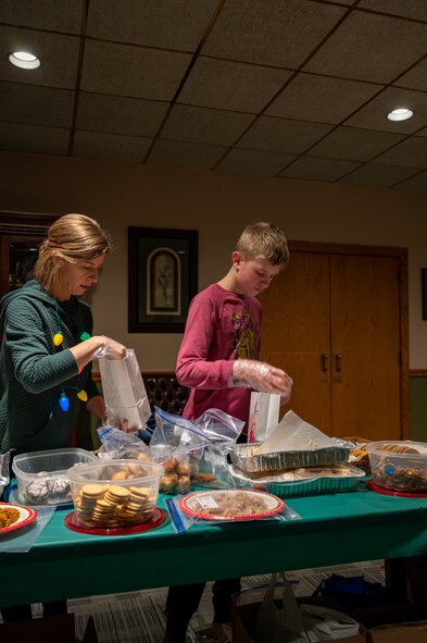 Key Spouses, Volunteers and the local Minot community came together to donate cookies for the Annual Cookie Drive this year, delivering over 9,000 cookies to Airmen on Minot Air Force Base, North Dakota, Dec. 21, 2022. These Airmen sacrifice time away from loved ones to ensure the strategic deterrence mission is carried out. (U.S. Air Force photo by Airman 1st class Alexander Nottingham)