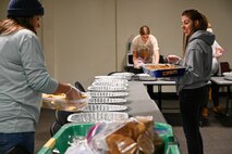 Key Spouses, Volunteers and the local Minot community came together to donate cookies for the Annual Cookie Drive this year, delivering over 9,000 cookies to Airmen on Minot Air Force Base, North Dakota, Dec. 21, 2022. These Airmen sacrifice time away from loved ones to ensure the strategic deterrence mission is carried out. (U.S. Air Force photo by Senior Airman Zachary Wright)