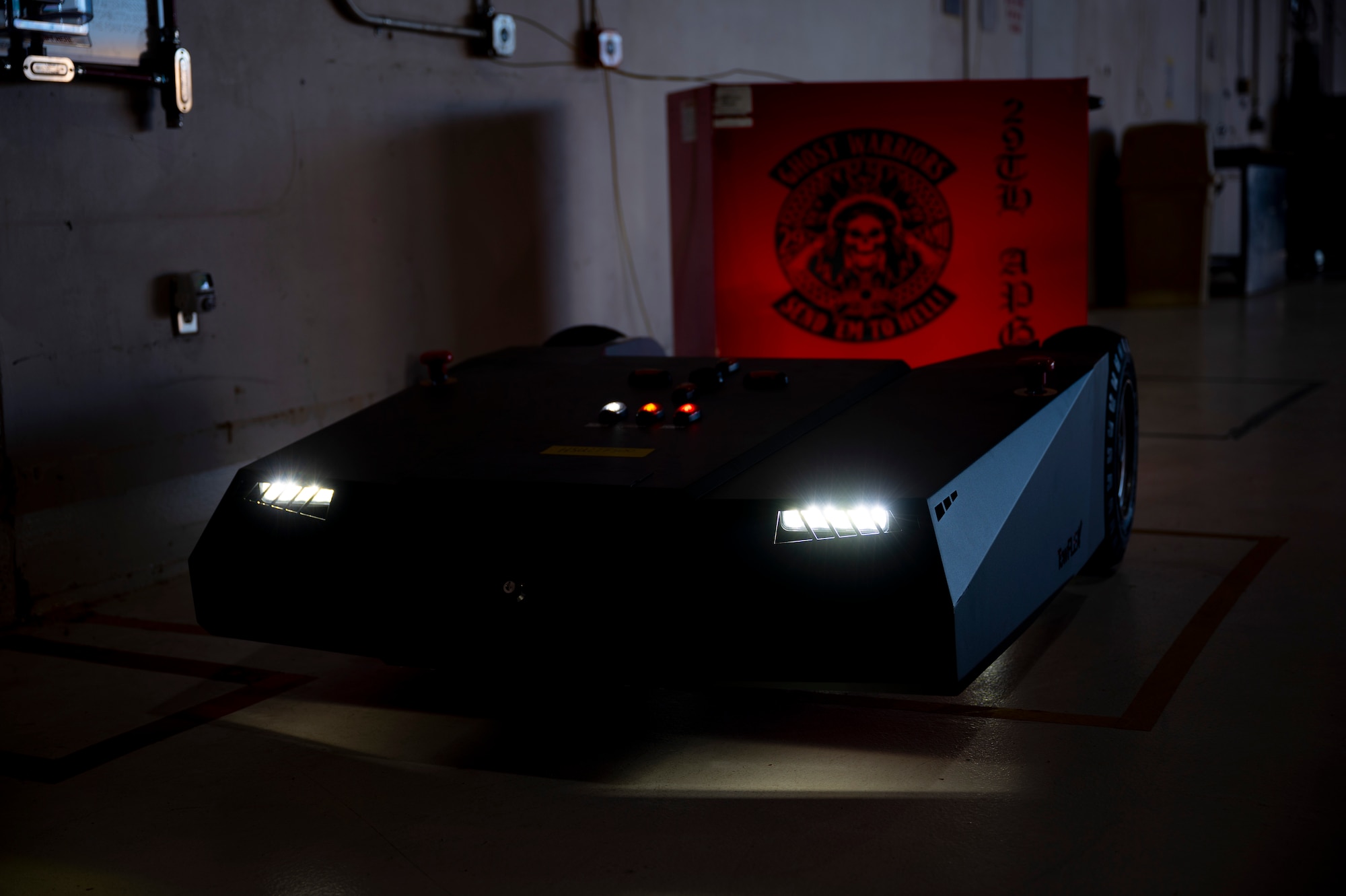 A TowFLEXX TF3 aircraft tug in a hangar at Holloman Air Force Base, New Mexico, Dec. 15, 2022. The TF3 is the smallest remote-controlled aircraft tug capable of tugging 20,000 pounds of weight and is used at Holloman to tow MQ-9 Reapers. (U.S. Air Force photo by Airman 1st Class Isaiah Pedrazzini)