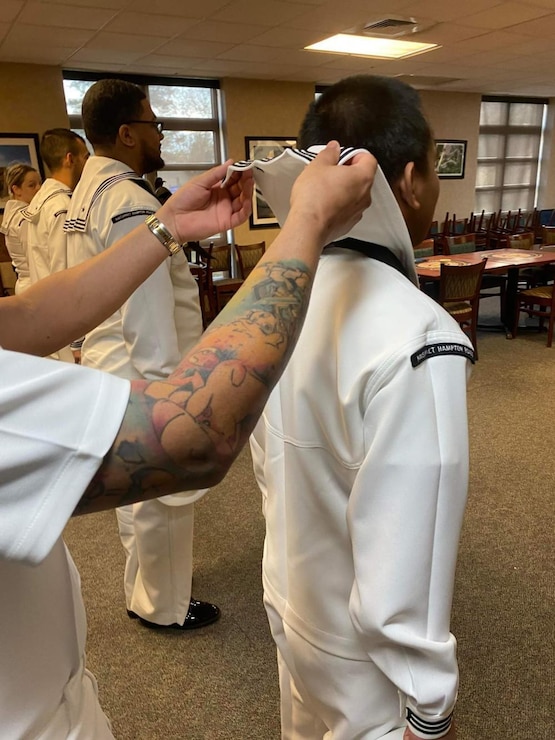 Naval Support Activity Hampton Roads-Northwest Annex Sailors stand in formation during a dress white uniform inspection at the installation Mar. 30.