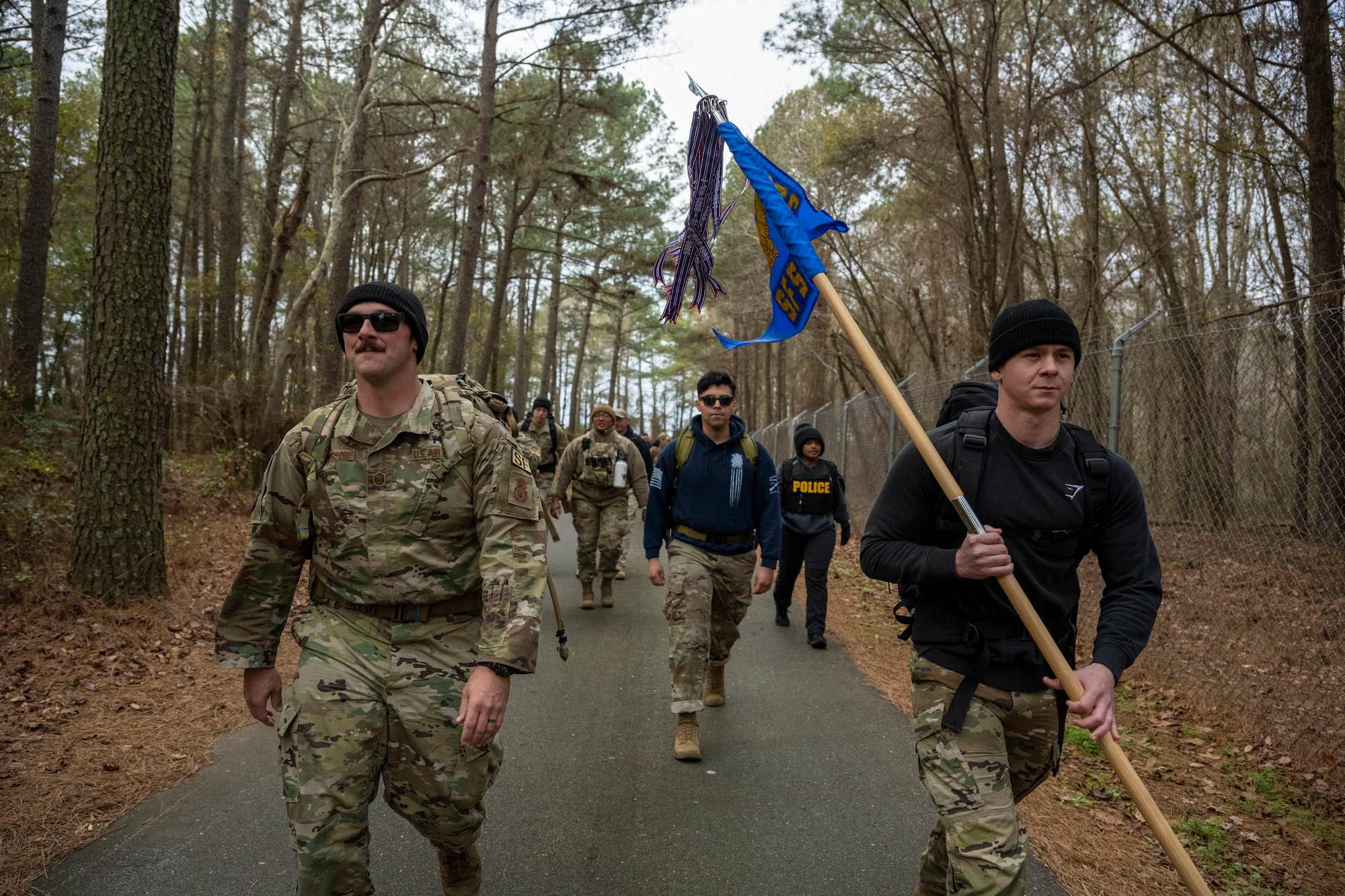 Special Agents assigned to Air Force Office of Special Investigation Detachment 216 participate in a six-mile ruck at Seymour Johnson Air Force Base, North Carolina, Dec. 21, 2022, in remembrance of those who were assigned to Task Force Crimson “Hustler 6” that lost their lives on Dec. 21, 2015. On that day, a suicide bomber detonated an improvised explosive device killing Special Agents Adrianna Vorderbruggen, Michael Cinco, Peter Taub, Chester McBride, and Security Forces defenders Technical Sgt. Joseph Lemm and Staff Sgt. Louis Bonacasa.  (U.S. Air Force photo by Senior Airman Kevin Holloway)