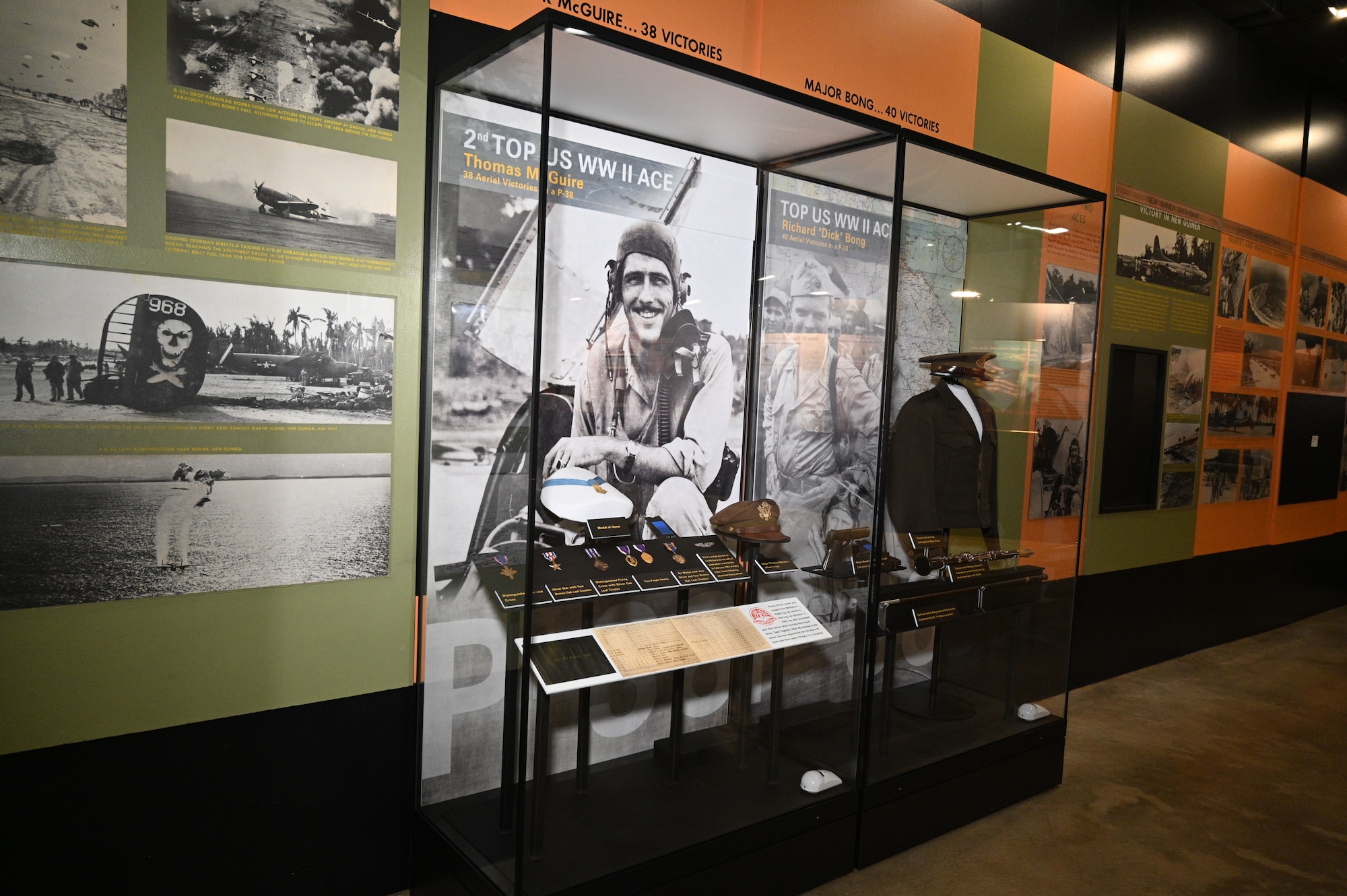 Display case featuring items from Maj. Thomas B. McGuire Jr. that includes pilot wings, air medals and the Medal of Honor from WWII.