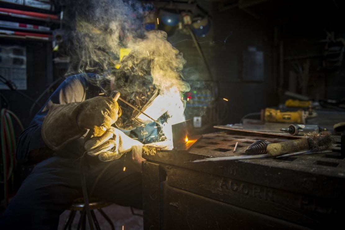 Hull Technician Fireman Matthew Townsend, from Washington, Illinois, welds a piece of angle iron aboard the Nimitz-class aircraft carrier USS Dwight D. Eisenhower (CVN 69). Ike is currently pierside at Norfolk Naval Shipyard in the basic phase of the optimized fleet response plan (OFRP). (U.S. Navy photo by Mass Communication Specialist 2nd Class Cameron Pinske/Released)