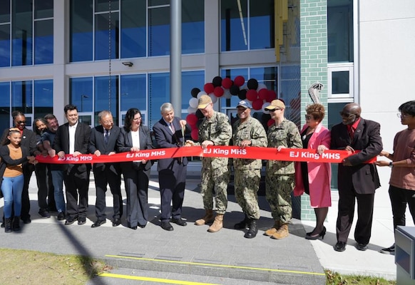 With the snip of a ribbon, a newly constructed and partially renovated E.J. King Middle High School was officially declared ready to teach during a ceremony here on Commander Fleet Activities Sasebo, September 21.

The ceremony, attended by such luminaries as Vice Adm. Yancy Lindsey, Commander, Navy Installations Command, Rear Adm. Carl A. Lahati, Commander, U.S. Naval Forces Japan / Navy Region Japan, Capt. David J. Adams, Commander, CFA Sasebo, Mr. Thomas Brady, Director, Department of Defense Education Activity, and Ms. Lois J. Rapp, DoDEA Pacific Director for Student Excellence, drew throngs of school children and teachers excited to be part of this moment in Sasebo History.