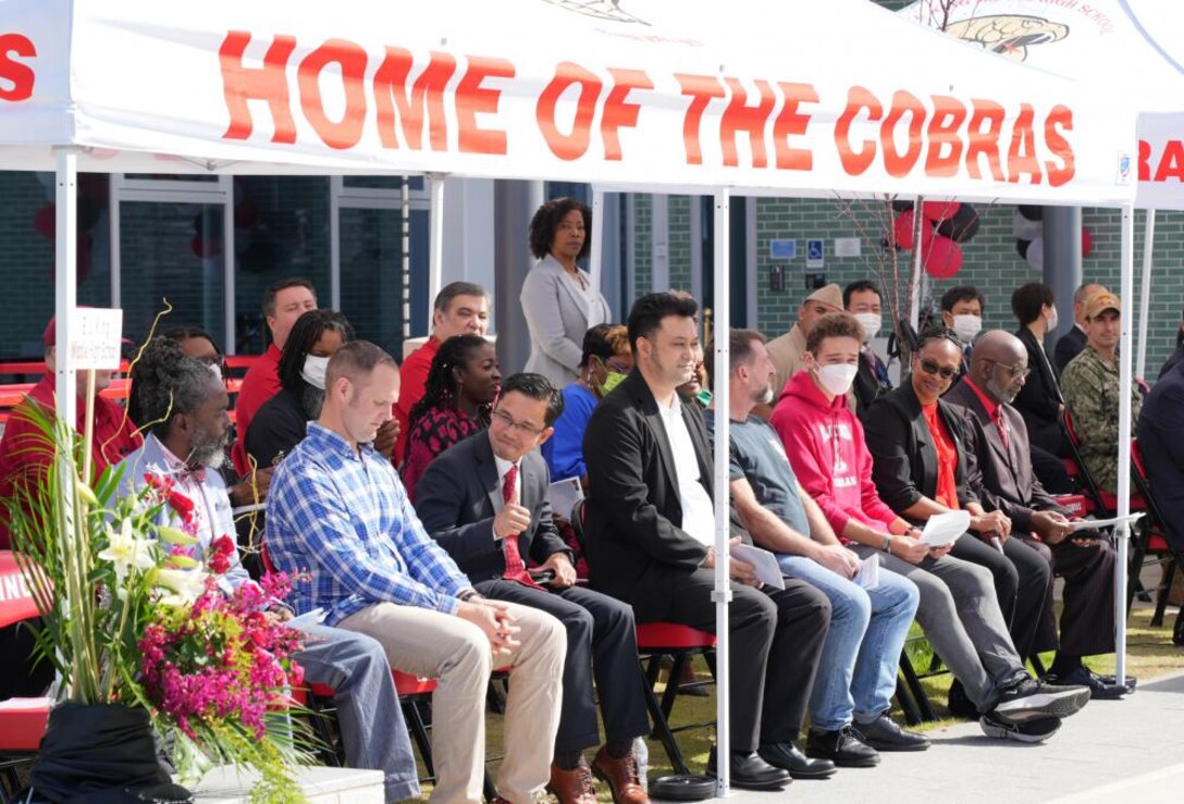 With the snip of a ribbon, a newly constructed and partially renovated E.J. King Middle High School was officially declared ready to teach during a ceremony here on Commander Fleet Activities Sasebo, September 21.

The ceremony, attended by such luminaries as Vice Adm. Yancy Lindsey, Commander, Navy Installations Command, Rear Adm. Carl A. Lahati, Commander, U.S. Naval Forces Japan / Navy Region Japan, Capt. David J. Adams, Commander, CFA Sasebo, Mr. Thomas Brady, Director, Department of Defense Education Activity, and Ms. Lois J. Rapp, DoDEA Pacific Director for Student Excellence, drew throngs of school children and teachers excited to be part of this moment in Sasebo History.