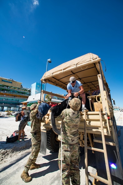 Florida Army National Guard Solders assist citizens and their dog off Fort Myers Beach, Florida, in response to Hurricane Ian, Oct. 2, 2022.