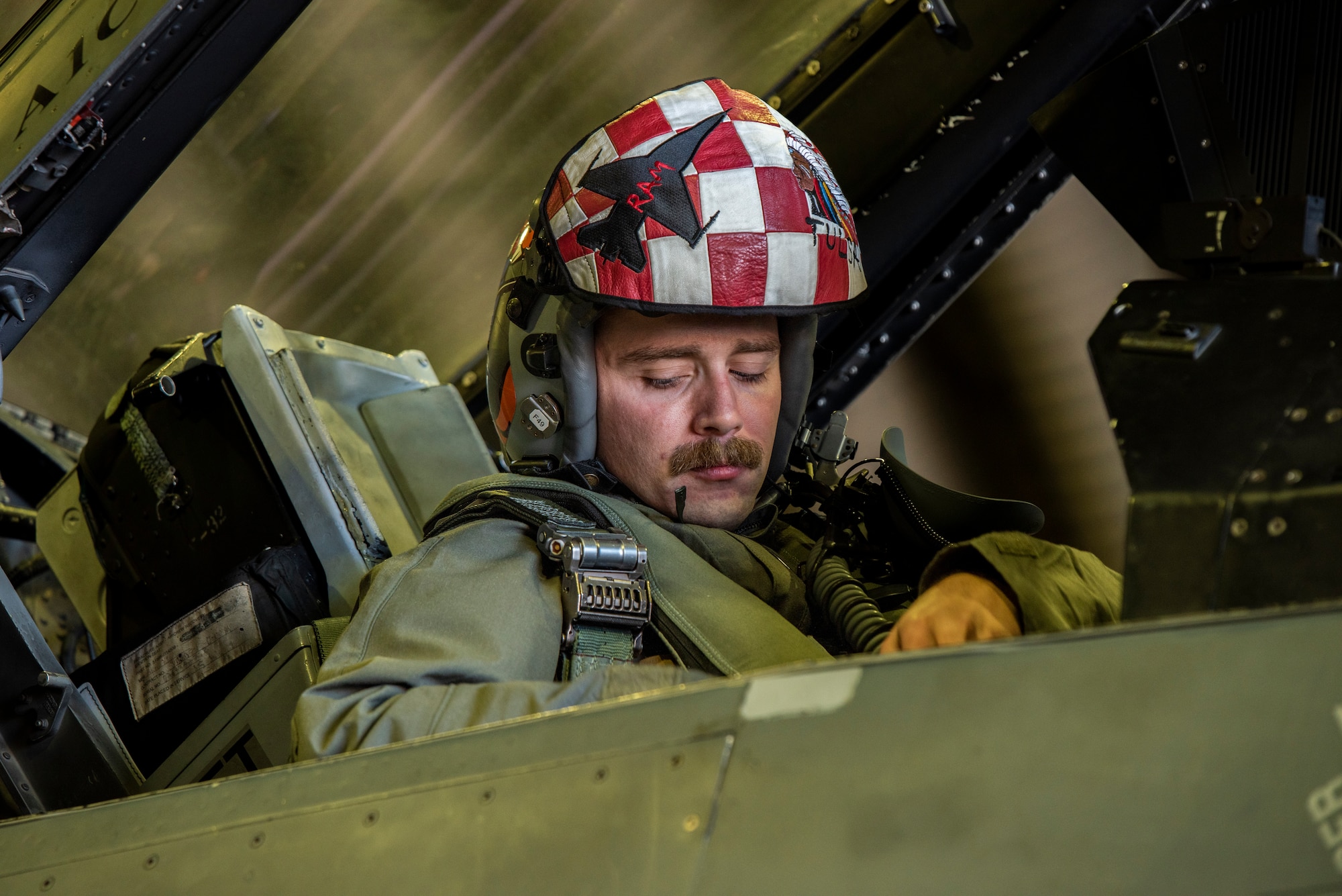 U.S. Air Force Capt. Boston Nimmer, 36th Fighter Squadron pilot secures his seatbelt in an F-16 Fighting Falcon before a training mission at Osan Air Base, Republic of Korea, Dec. 28, 2022.