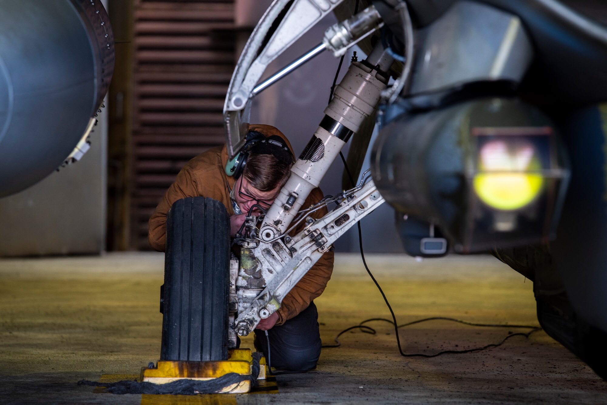 U.S. Air Force Senior Airman Nathaniel Kendrick, 36th Fighter Generation Squadron (FGS) crew chief, performs pre-flight checks on an F-16 Fighting Falcon before a training mission at Osan Air Base, Republic of Korea, Dec. 28, 2022.