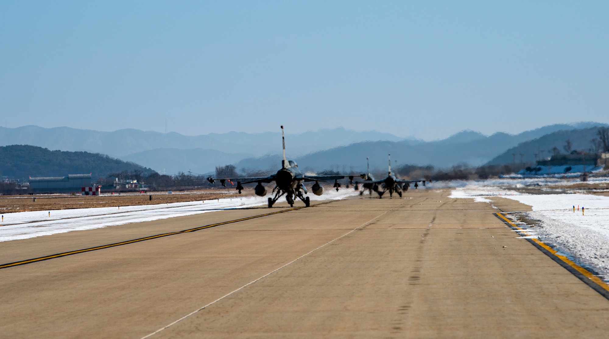 Three F-16 Fighting Falcon’s assigned to the 36th Fighter Squadron taxi on the runway before flight during a training mission at Osan Air Base, Republic of Korea, Dec. 28, 2022.