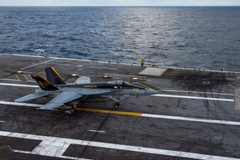 An F/A-18E Super Hornet fighter jet, attached to the "Rampagers" of Strike Fighter Squadron (VFA) 83, lands on the flight deck aboard the Nimitz-class aircraft carrier USS Dwight D. Eisenhower (CVN 69), Dec. 13, 2022.