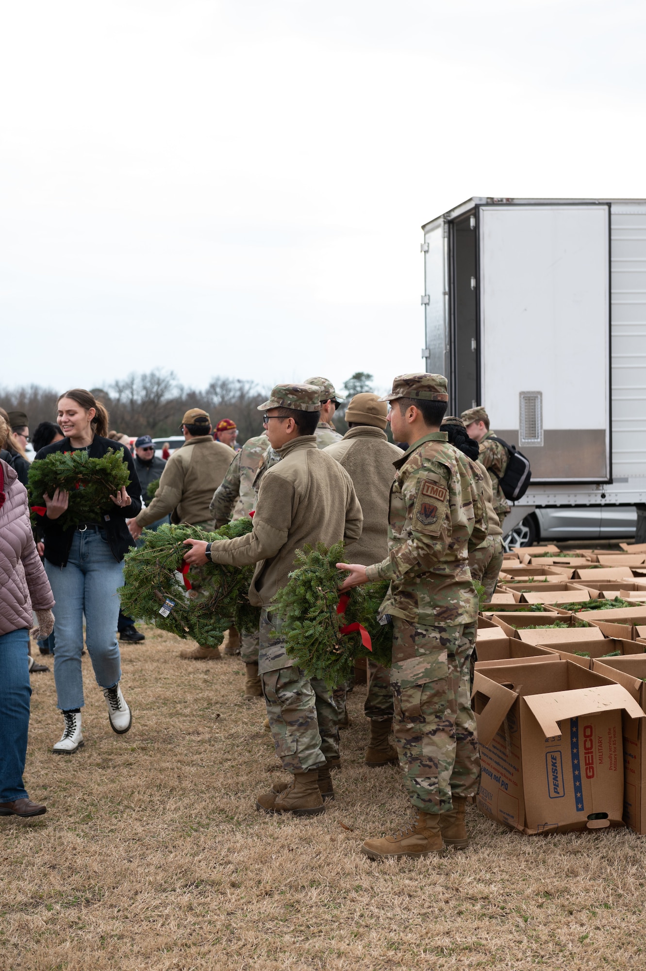 Airmen assigned to Seymour Johnson Air Force, North Carolina, volunteer during Wreaths Across America at Eastern Carolina Veterans Cemetery, Goldsboro, N.C., Dec. 17, 2022. The event is held in unity with national cemeteries nationwide to honor those who have served in the armed forces and their families. (U.S. Air Force photo by Airman 1st Class Rebecca Sirimarco-Lang)