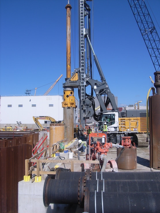 Drilling for secant pile installation on Berth 11 as part of Portsmouth Naval Shipyard’s Multi-Mission Dry Dock #1 construction.