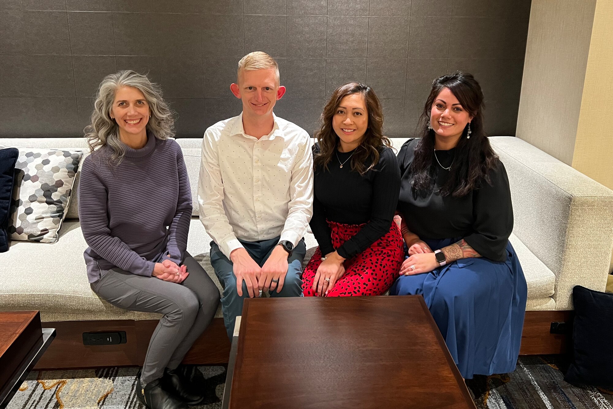 Four members sitting in an office setting