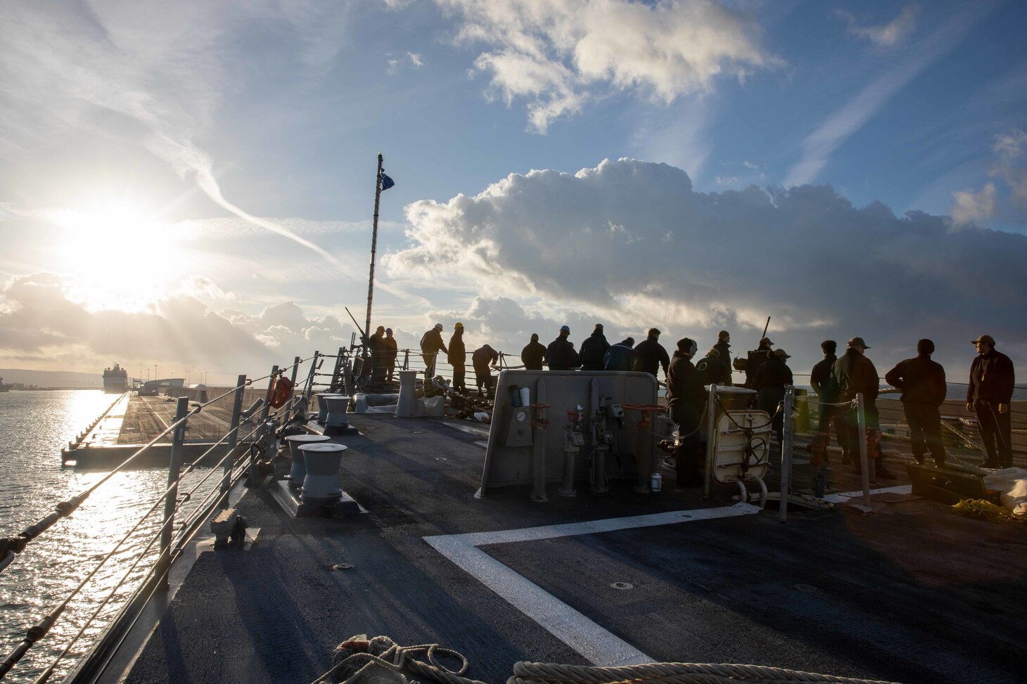 (Dec. 29, 2022) Sailors assigned to the ArleighBurke-class guided-missile destroyer USS Nitze (DDG 94) heave line as the ship arrives in Civitavecchia, Italy for a scheduled port visit, Dec. 29, 2022. The George H.W. Bush Carrier Strike Group is on a scheduled deployment in the U.S. Naval Forces Europe area of operations, employed by U.S. Sixth Fleet to defend U.S., allied, and partner interests.
