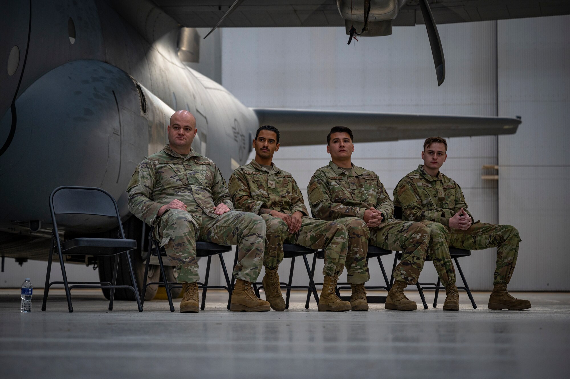 Graduates assigned to the 317th Maintenance Group listening to the opening remarks during the first Lethal Expeditionary Airman Development graduation at Dyess Air Force Base, Texas, Dec. 16, 2022. LEAD is a rigorous, locally developed course designed to create a more specialized, ready force that is better trained and equipped to support ACE objectives. LEAD provides added logistics capabilities in support of forward operations and does so with a significantly reduced footprint. (U.S. Air Force photo by Senior Airman Colin Hollowell)