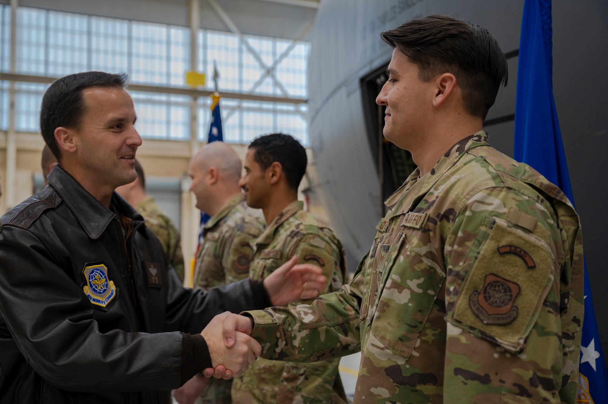 Col. Steven Wick, 317th Airlift Wing vice commander, left, shakes hands with Staff Sgt. Seth Crawford, 317th Maintenance Group Lethal Expeditionary Airman Development graduate, following the first LEAD graduation at Dyess Air Force Base, Texas, Dec. 16, 2022. LEAD is a rigorous, locally developed course designed to create a more specialized, ready force that is better trained and equipped to support ACE objectives. LEAD provides added logistics capabilities in support of forward operations and does so with a significantly reduced footprint. (U.S. Air Force photo by Senior Airman Colin Hollowell)