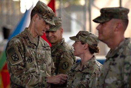 Illinois Army National Guard Lt. Col. Elizabeth Roxworthy, who served as the Combined Joint Task Force – Horn of Africa executive officer during the 404th Maneuver Enhancement Brigade’s deployment, talks with Maj. Gen. William Zana, then-Commander of CJTF-HOA, during a patching ceremony. Nearly 200 Illinois Army National Guard Soldiers serving on the deployment arrived home just before the Thanksgiving holiday.