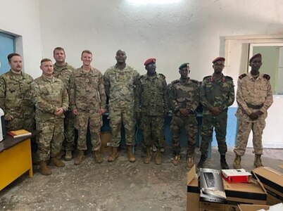 1st. Lt.  Patrick Reynolds, Embassy Liaison Officer and members from the Combined Joint Task Force – Horn of Africa operations directorate pose with a Djiboutian Military Organization. Nearly 200 Illinois Army National Guard Soldiers serving on the deployment arrived home just before the Thanksgiving holiday.