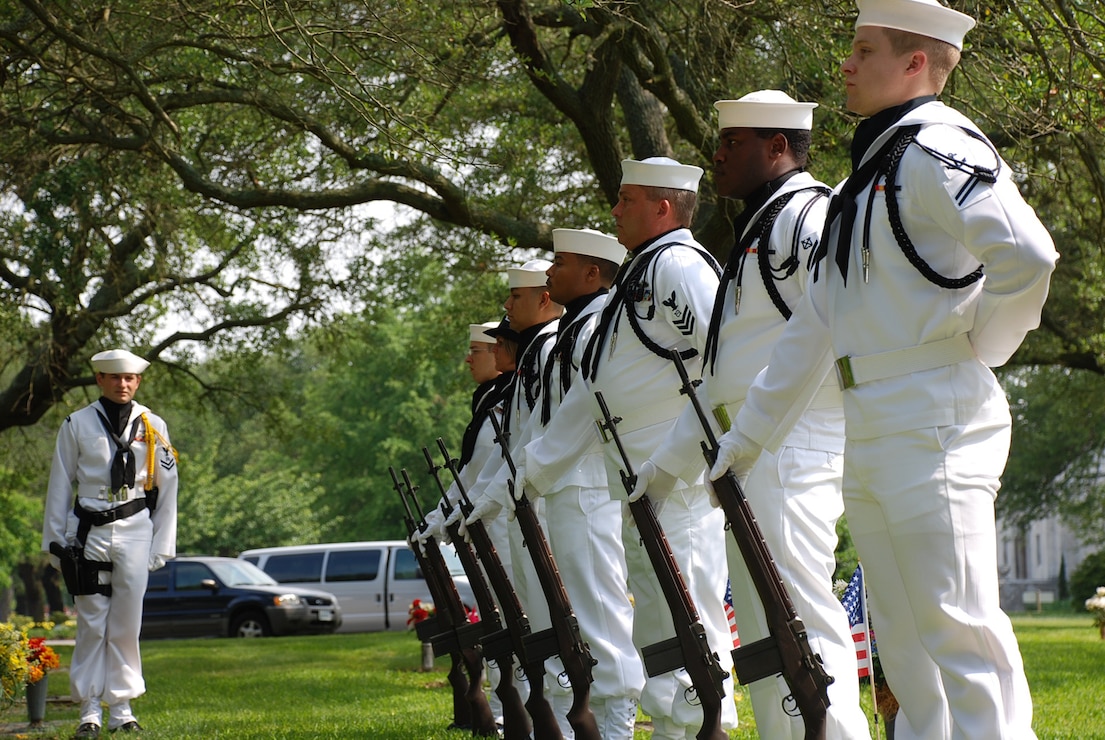 Petty Officer 2nd Class Dmitriy Ageyenkov, a store keeper, waits for the moment to bring Commander Navy Region Mid-Atlantic Honor Guard team one to attention during a ceremony.