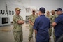 Rear Admiral Scott Gray, Commander, Navy Region Mid-Atlantic, speaks with representatives from National Oceanic and Atmospheric Administration (NOAA), United States Coast Guard and the installation port operations team during his visit to Pier 2 at Naval Station Newport. The visit is the first trip to Newport for the region commander since taking charge of NRMA in late July.