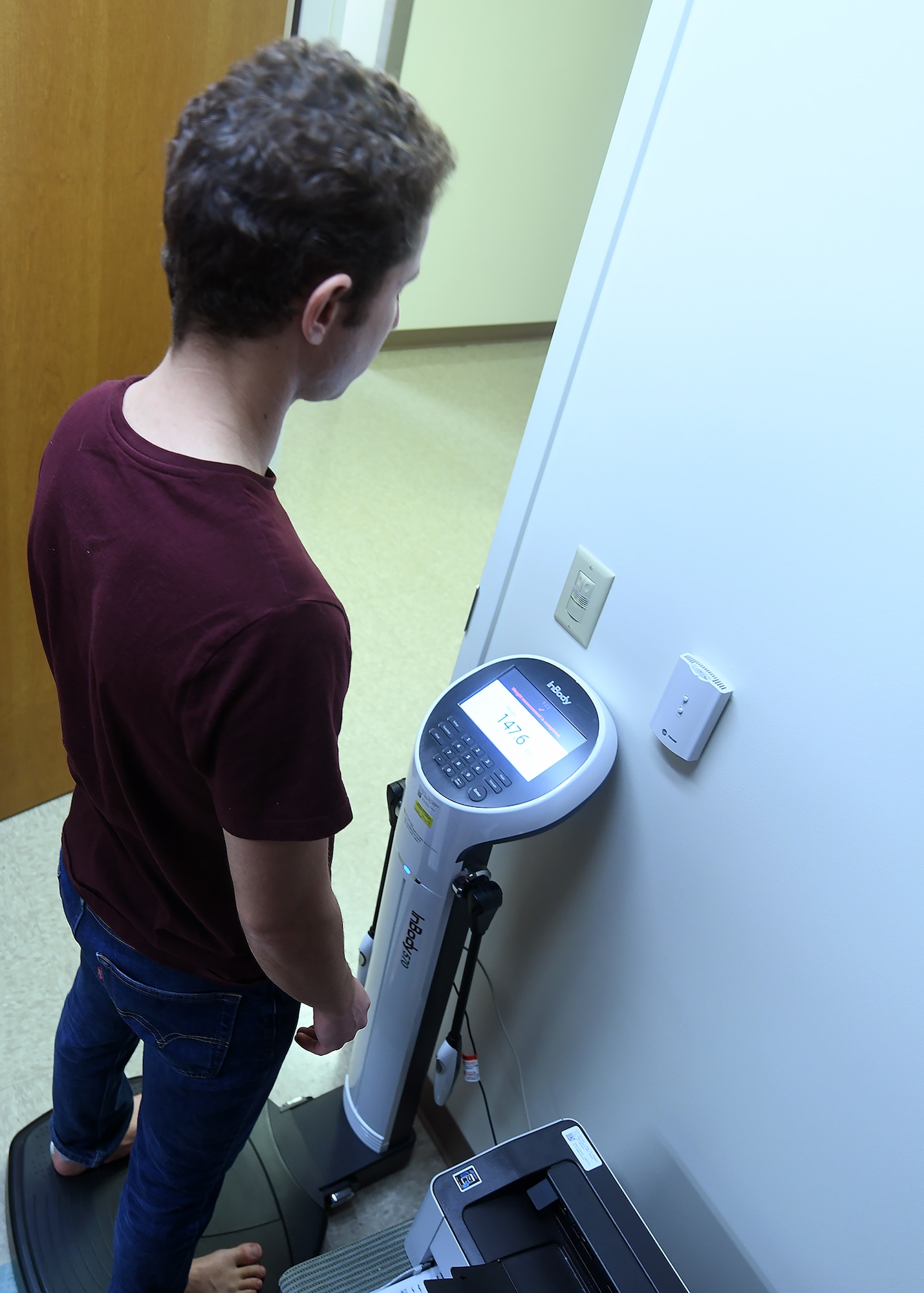 Man stands on machine similar to a scale