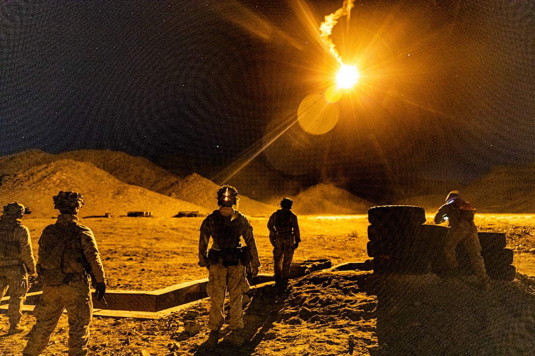 U.S. Marines with 3rd Battalion, 7th Marine Regiment defend their position during a live-fire night range at Marine Corps Air Ground Combat Center, Twentynine Palms, California, Dec. 12, 2022. Marines maintain lethality by training during day and night to increase preparedness for any situation. (U.S. Marine Corps photo by Cpl. Jonathan Willcox)