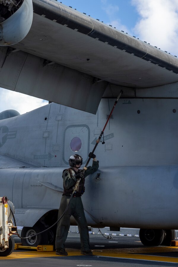 PACIFIC OCEAN (Nov. 30, 2022) -A U.S. Marine assigned to Marine Medium Tiltrotor Squadron (VMM) 362 (Rein.), 13th Marine Expeditionary Unit, performs a fresh water rinse on the engines of an MV-22B Osprey, Nov. 30. U.S. Marine Corps pilots continuously fly to stay current in their qualifications contributing to the readiness of the 13th Marine Expeditionary Unit. The 13th MEU is embarked with the Makin Island Amphibious Ready Group, comprised of amphibious assault ship USS Makin Island (LHD 8) and amphibious transport docs USS Anchorage (LPD 23) and USS John P. Murtha (LPD 26), conducting routine operations in the U.S. 3rd Fleet. (U.S. Marine Corps photo by Sgt. Nicolas Atehortua)