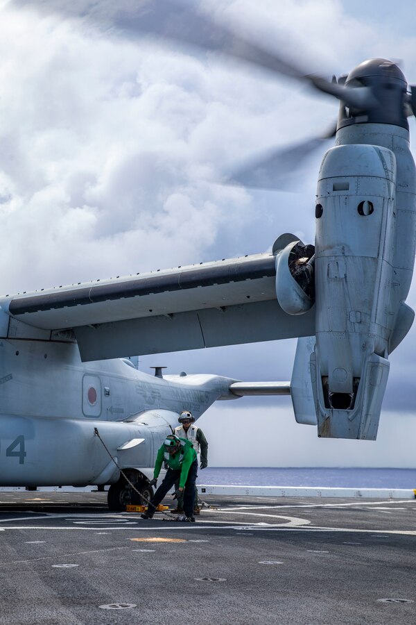 PACIFIC OCEAN (Dec. 5, 2022) - U.S. Navy Sailors assigned to amphibious transport dock USS Anchorage (LPD 23) and U.S. Marines with 13th Marine Expeditionary Unit chain down an MV-22B Osprey assigned to Marine Medium Tiltrotor Squadron (VMM) 362 (Rein.) aboard the USS Anchorage (LPD 23), Dec. 5. A force in readiness, the 13th MEU trains to rapidly to respond to crisis across all domains. The 13th Marine Expeditionary Unit is embarked with the Makin Island Amphibious Ready Group, comprised of amphibious assault ship USS Makin Island (LHD 8) and amphibious transport dock ships USS John P. Murtha (LPD 26) and the Anchorage, and operating in the U.S. 7th Fleet area of operations to enhance interoperability with Allies and partners and serve as a ready-response force to defend peace and maintain stability in the Indo-Pacific region. (U.S. Marine Corps Photo by Sgt. Brendan Custer)