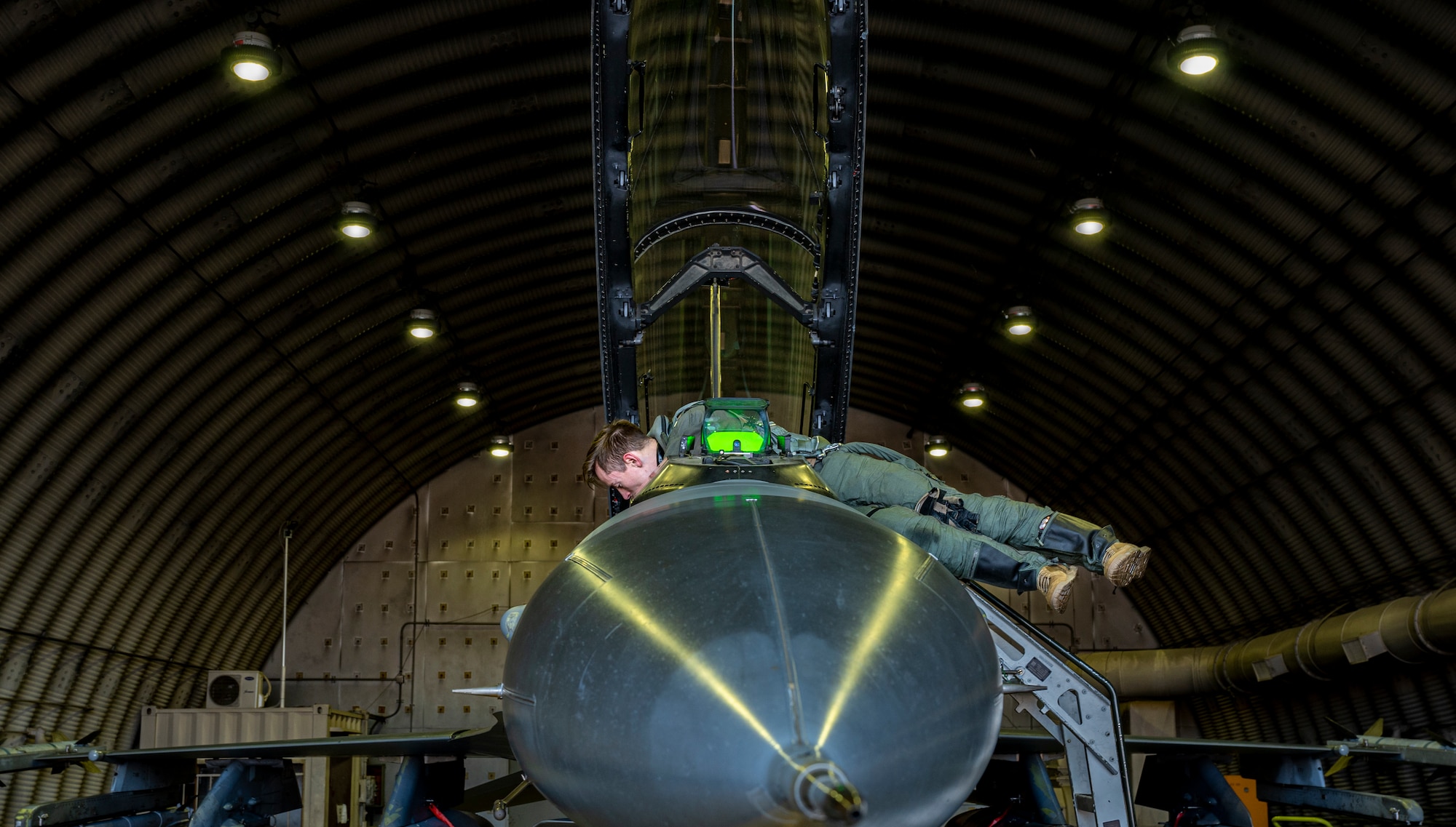 U.S. Air Force Capt. Trevor Schmidt, 36th Fighter Squadron (FS) pilot, performs pre-flight checks on an F-16 Fighting Falcon before a training mission at Osan Air Base, Republic of Korea, Dec. 28, 2022.
