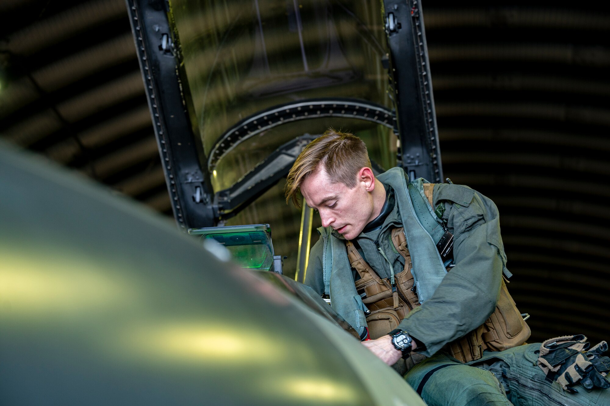 U.S. Air Force Capt. Trevor Schmidt, 36th Fighter Squadron (FS) pilot, performs pre-flight checks on an F-16 Fighting Falcon before a training mission at Osan Air Base, Republic of Korea, Dec. 28, 2022.