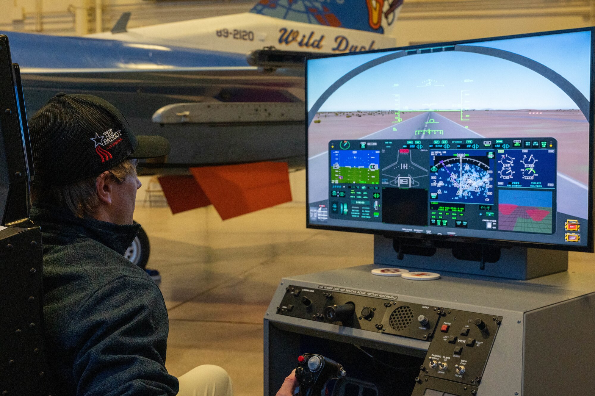 A participant of the Patriot All-American golf tournament takes part in a flight hypoxia simulator during a base visit, Dec. 27, 2022, at Luke Air Force Base, Arizona.