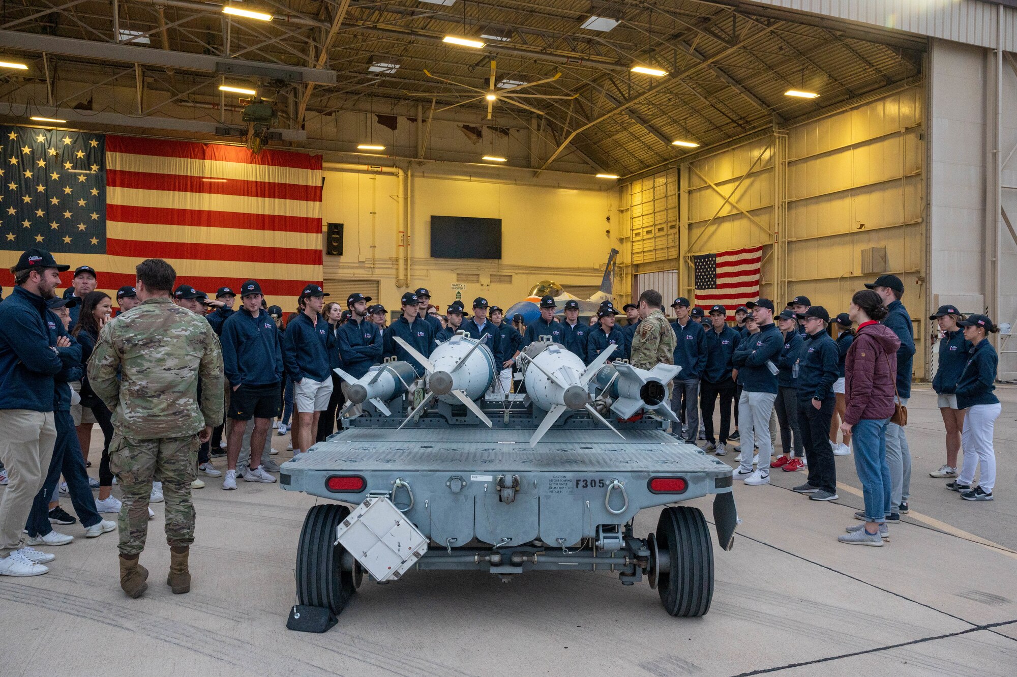 U.S. Air Force Airman from the 56th Fighter Wing showcase various munitions during a base visit, Dec. 27, 2022, at Luke Air Force Base, Arizona.