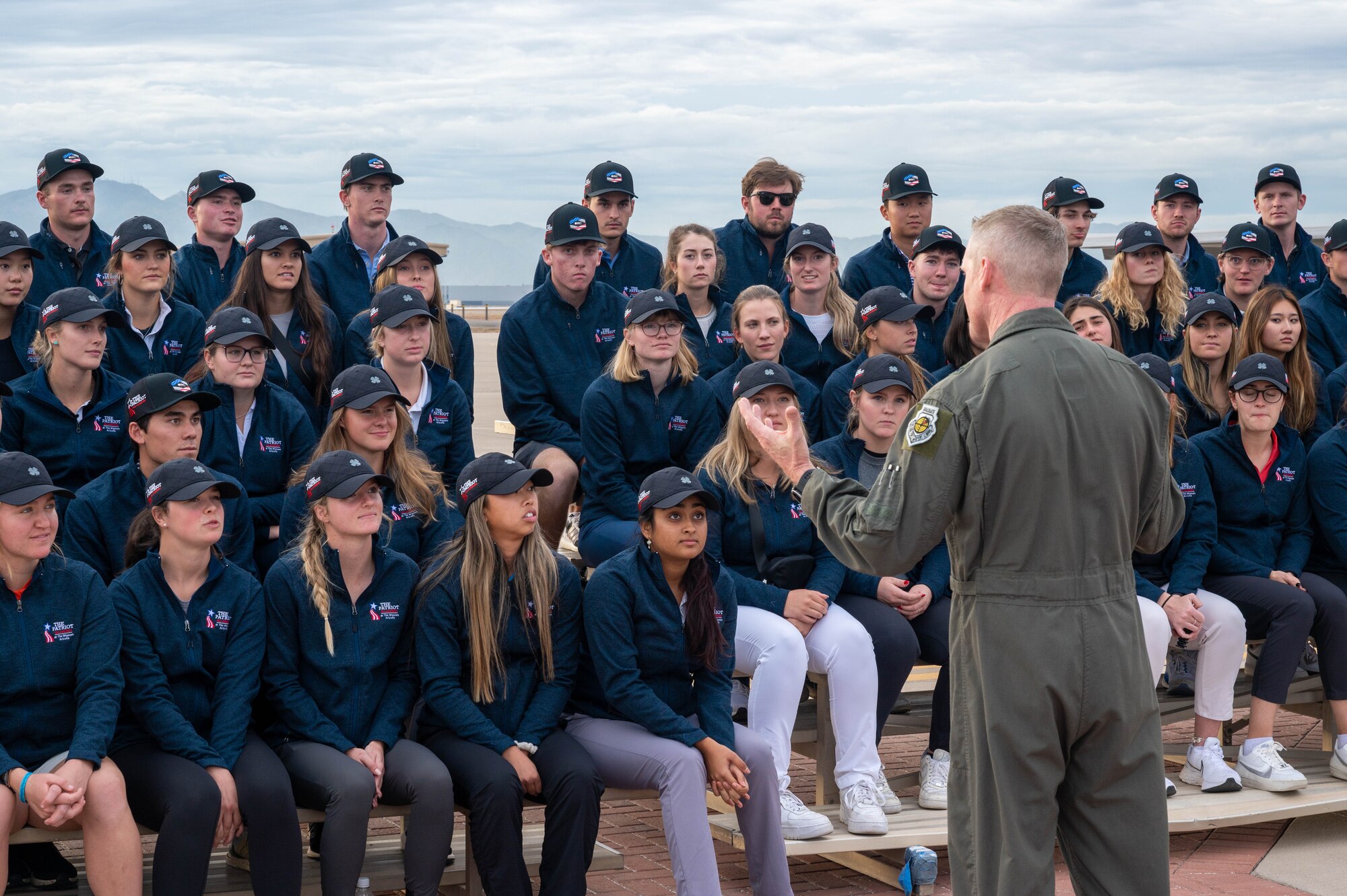 U.S. Air Force Brig. Gen. Jason Rueschhoff, 56th Fighter Wing commander, speaks to participants of the Patriot All-American golf tournament during a base visit, Dec. 27, 2022, at Luke Air Force Base, Arizona.