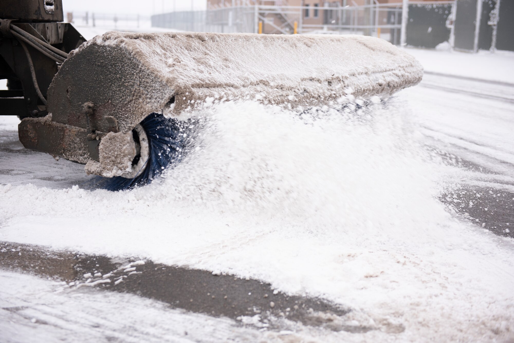 Staff Sgt. Masroy Plowright, 51st Civil Engineering Squadron pavement and equipment technician, clears the roads of snow