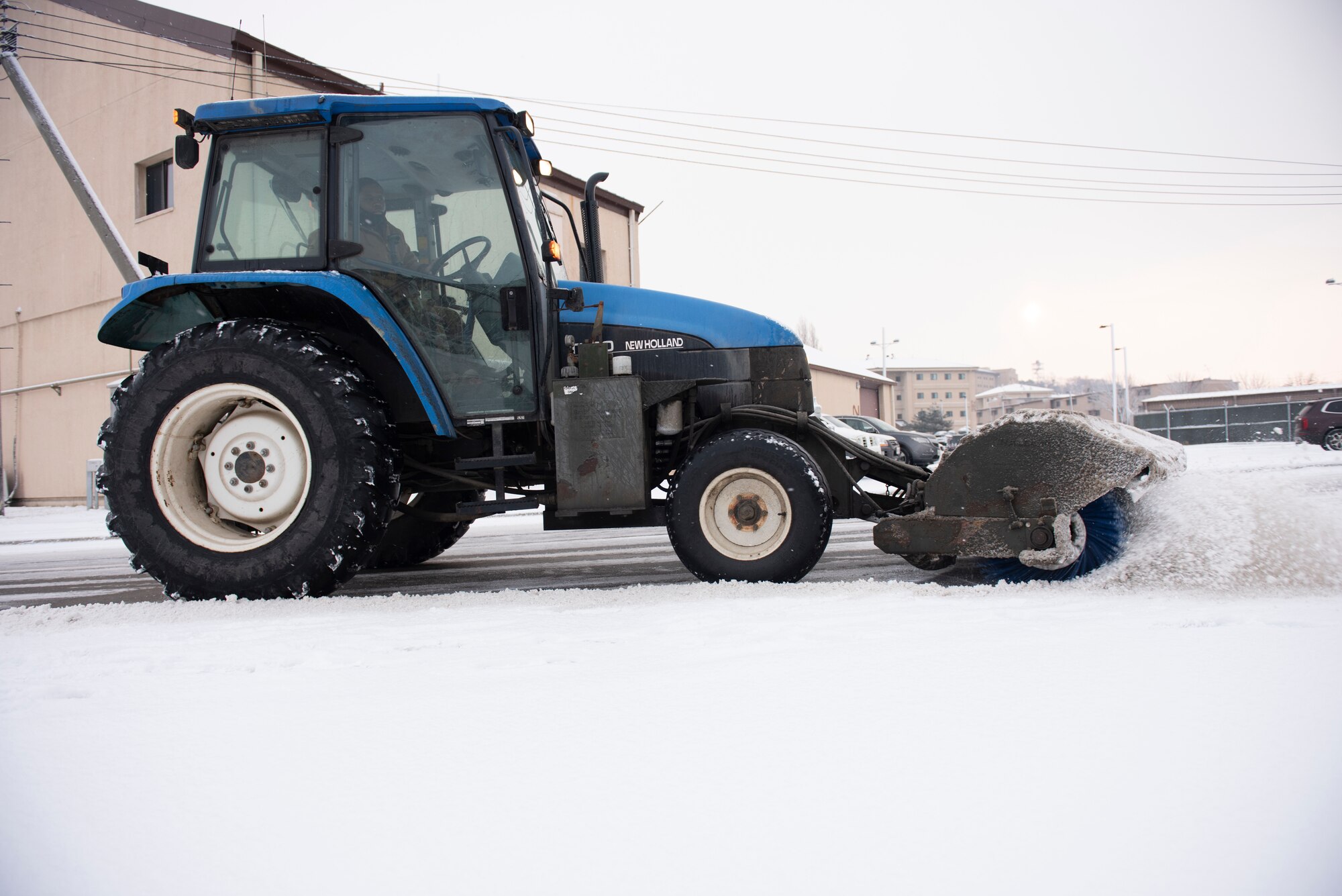 Staff Sgt. Masroy Plowright, 51st Civil Engineering Squadron pavement and equipment technician, clears the roads of snow