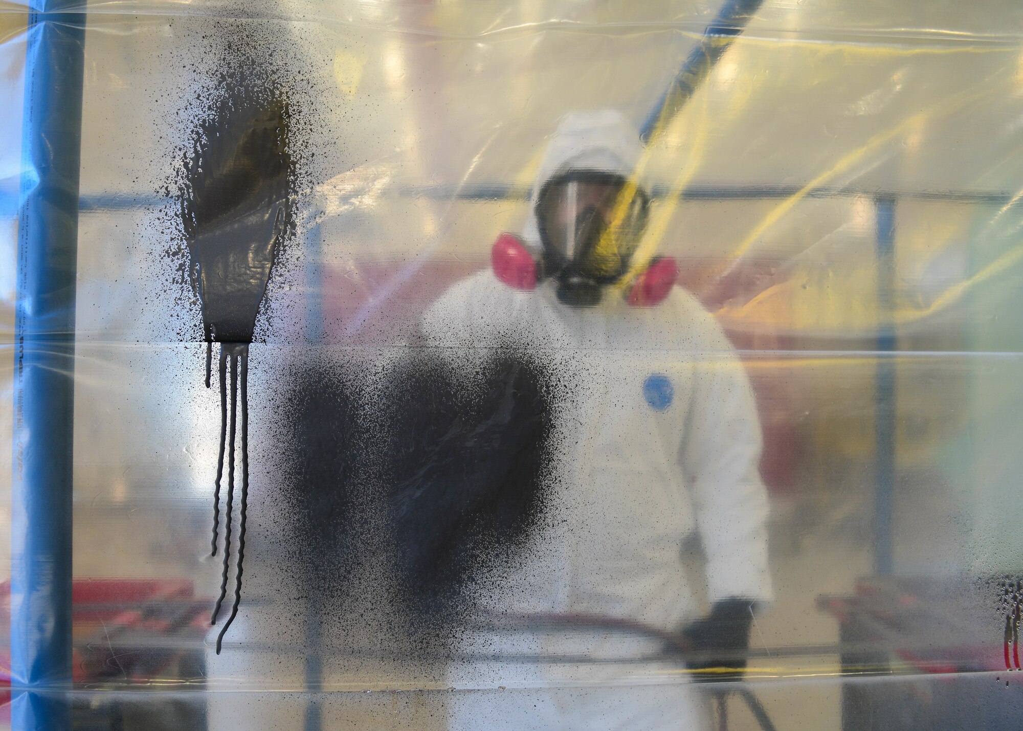 U.S. Staff Sgt. Cameron Keeney, 31st Maintenance Squadron aircraft structural maintenance craftsman, tests the paint on the wall of the Tent N Vent at Aviano Air Base, Italy. The Tent N Vent cuts down production time and allows the aircraft part to be painted at Aviano instead of the whole aircraft being transported to SABCA, a Belgian aerospace company. (U.S. Air Force photo by Senior Airman Brooke Moeder)