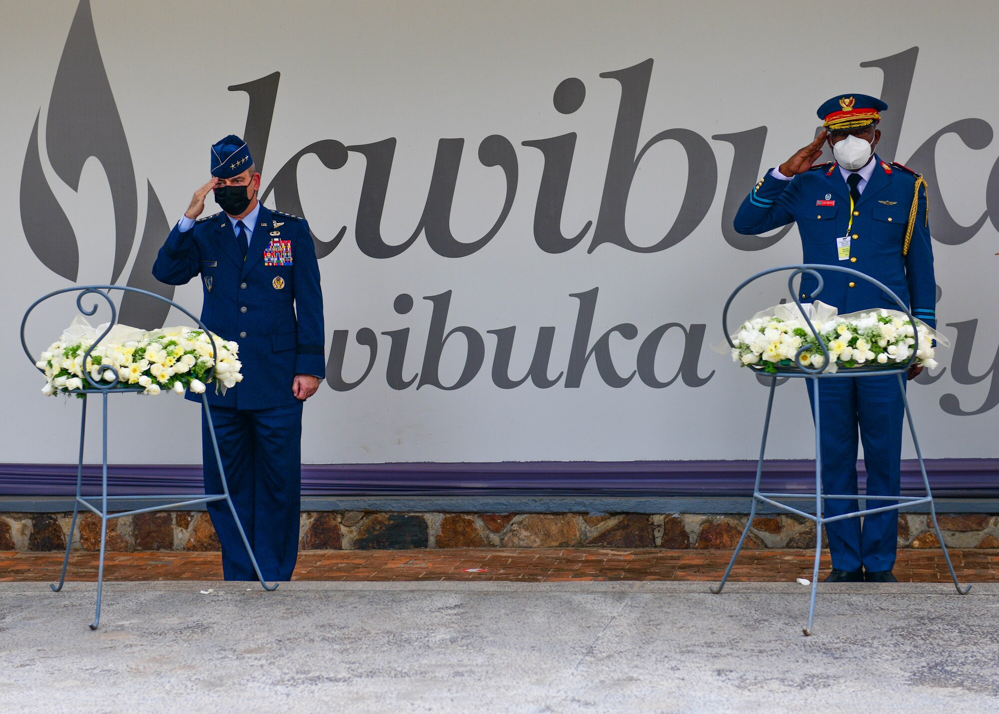 U.S. Air Force Gen. Jeffrey Harrigian, U.S. Air Forces in Europe and Air Forces Africa commander, left, and Armed Forces of the Democratic Republic of the Congo Général de brigade aérienne Franck Lebe Ngama, Deputy Air Chief, Sous-chef d'état-major de l'armée de l'air, salute during a wreath laying ceremony at the Genocide Memorial in Kigali, Rwanda, Jan. 25, 2022. The Genocide Memorial is the final resting place for more than 250,000 victims of the genocide. Harrigian and Ngama are participating in the 2022 African Air Chiefs Symposium, an event that includes a variety of engagement opportunities for participating nations to discuss key challenges confronting African air chiefs. (U.S. Air Force photo by Senior Airman Brooke Moeder)