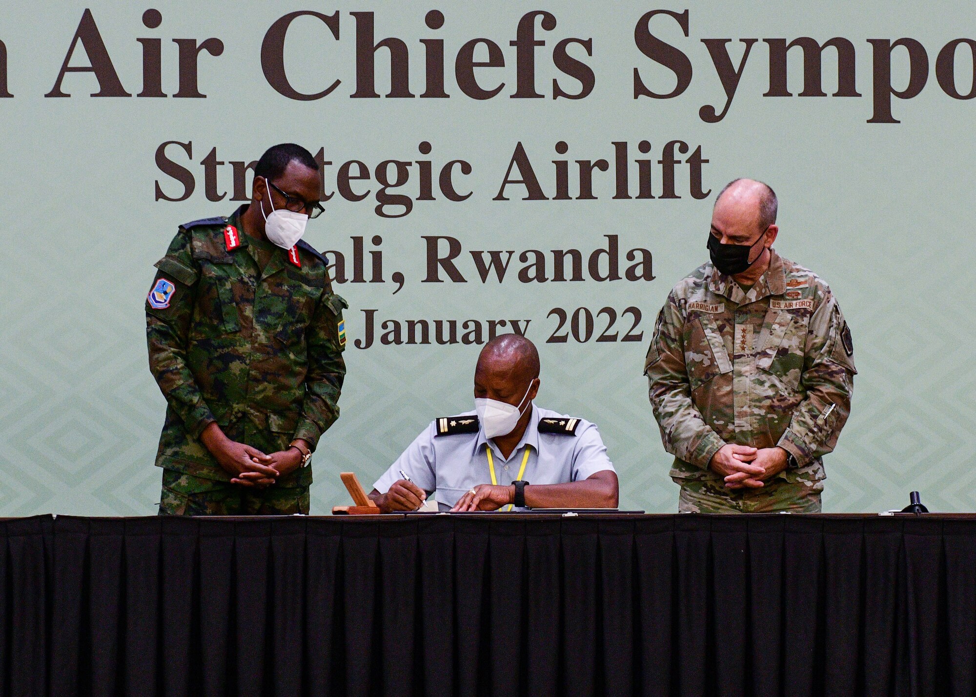 Burundi National Defence Force Brig. Gen. Hermalas Ndabashinze, Burundi Air Force Chief, middle, signs a charter to join the Association of African Air Forces while Rwandan Air Force Lt. Gen. Jean Jacques Mupenzi, Rwandan Air Chief of Staff, left, and U.S. Air Force Gen. Jeffrey Harrigian, U.S. Air Forces in Europe and Air Forces Africa commander, observe at the 2022 African Air Chiefs Symposium in Kigali, Rwanda, Jan. 26, 2022. During the 2014 AACS, there was widespread recognition of the need to formalize the AAAF in order to maximize the utility of the forum. The AAAF was established to foster and strengthen cooperation and mutual support among its members. (U.S. Air Force photo by Senior Airman Brooke Moeder)