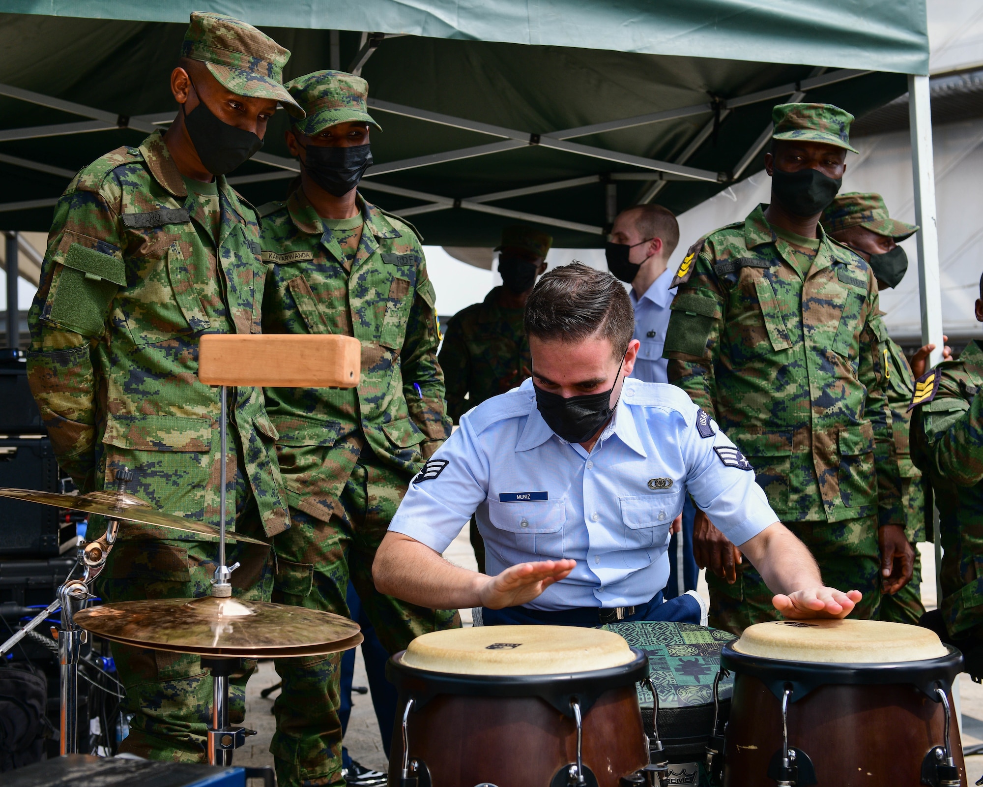 U.S. Air Force Senior Airman Luis Minuz-Marti, U.S. Air Forces in Europe Band pianist and percussionist, practices with members of the Rwanda Defence Force Band during a rehearsal for the 202 African Air Chief Symposium in Kigali, Rwanda, Jan. 21, 2022. The USAFE Band is visiting Rwanda to present several virtual educational events and concerts. The USAFE band’s performances bolster international partnership and support African ties. (U.S. Air Force photo by Brooke Moeder)