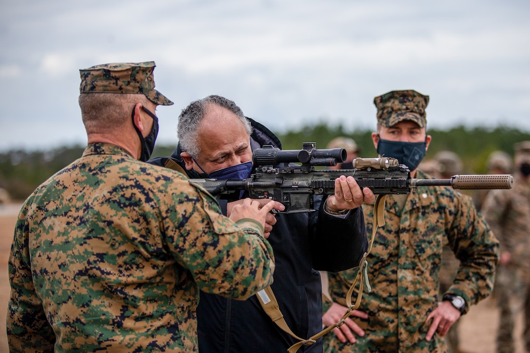 Secretary of the Navy Carlos Del Toro learns how to operate an M27 Infantry Automatic Rifle during a live-fire demonstration of range G-36 at Camp Lejeune, North Carolina, Jan. 28, 2022.