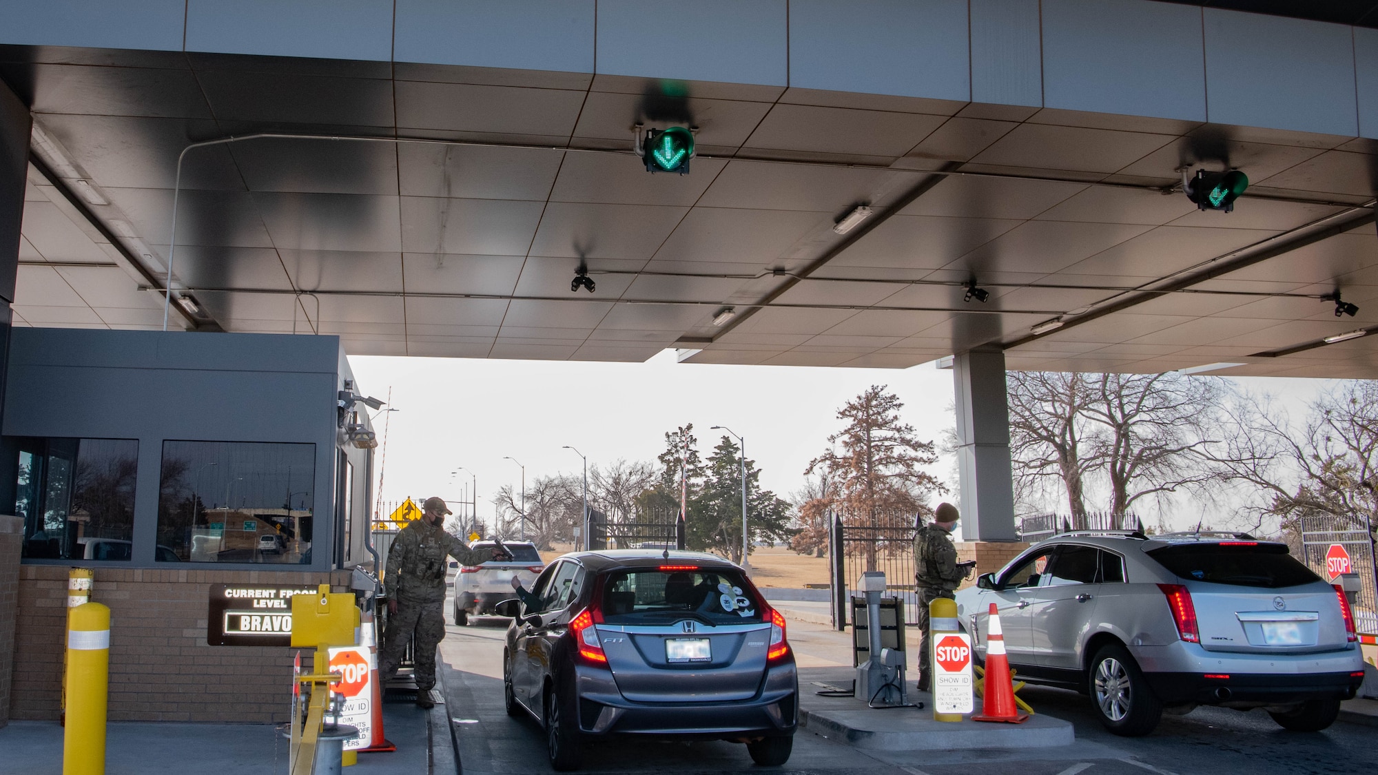 Cars approach military gate