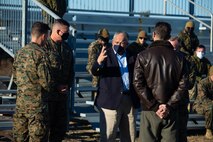 Secretary of the Navy Carlos Del Toro speaks with Maj. Gen. Michael Cederholm, 2nd Marine Aircraft Wing commanding general, and other Marine Corps leaders at Marine Corps Auxiliary Landing Field (MCALF) Bogue, North Carolina, Jan. 27, 2022. While at MCALF Bogue, Del Toro met with II Marine Expeditionary Force leadership and was given an Expeditionary Advanced Based Operations demonstration. (U.S. Marine Corps photo by Michele Clarke)