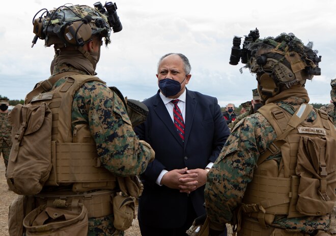 Secretary of the Navy Carlos Del Toro, center, speaks with Marines from 1st Battalion 6th Marines, while touring range G-36 on Marine Corps Base Camp Lejeune (MCB Camp Lejeune), North Carolina, Jan. 28, 2022. The Secretary of the Navy toured MCB Camp Lejeune to visit II Marine Expeditionary Force and Lejeune Memorial Gardens and viewed the ongoing construction improvements, public private venture housing and hurricane recovery progress on the installation. (U.S. Marine Corps photo by Lance Cpl. Antonino Mazzamuto)