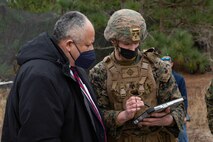 Secretary of the Navy Carlos Del Toro, left, speaks with U.S. Marine Lance Cpl. Kyle Barton, right, intelligence specialist with 1st Battalion 6th Marines, while touring range G-36 on Marine Corps Base Camp Lejeune (MCB Camp Lejeune), North Carolina, Jan. 28, 2022. The Secretary of the Navy toured MCB Camp Lejeune to visit II Marine Expeditionary Force and Lejeune Memorial Gardens and viewed the ongoing construction improvements, public private venture housing and hurricane recovery progress on the installation. (U.S. Marine Corps photo by Lance Cpl. Antonino Mazzamuto)