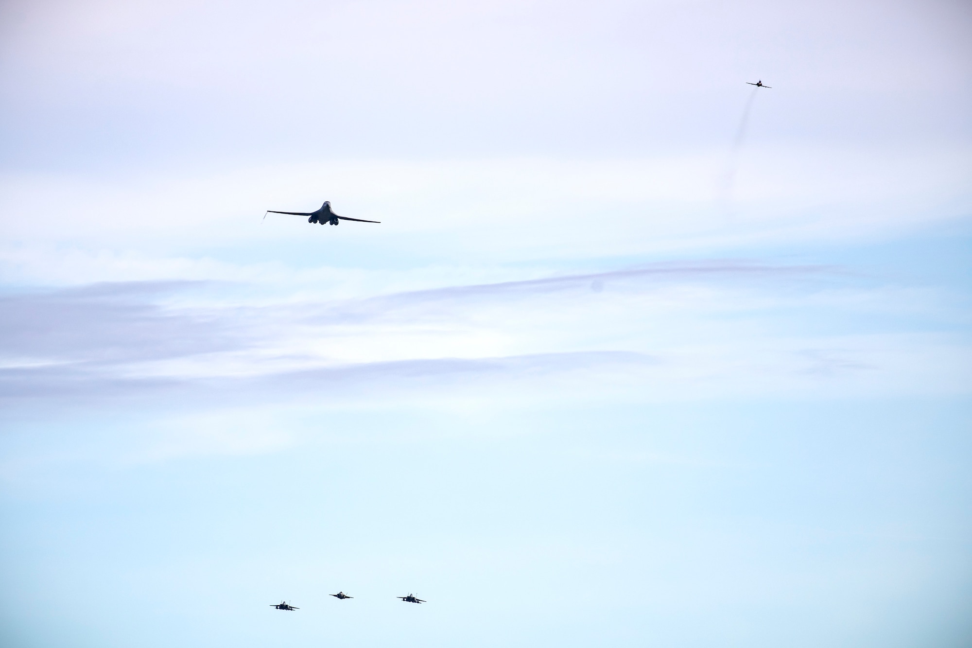 Aircraft from the U.S. Air Force and the Royal Air Force fly overhead at Duxford Airfield, England, Feb. 1, 2021. The flyover was in commemoration of the 80th anniversary of the Eighth Air Force. Events like these celebrate the continued USAF-RAF partnership and observe dissimilar U.S. and RAF aircraft integrating on approach to Duxford Airfield. (U.S. Air Force photo by Senior Airman Eugene Oliver)